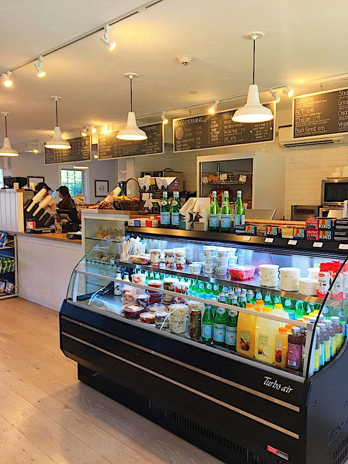 A Town cafe counter with breakfast sandwiches and cold drinks